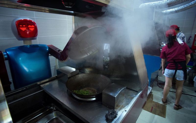 Robot cooking vegetables in a kitchen of a restaurant in Kunshan via Getty